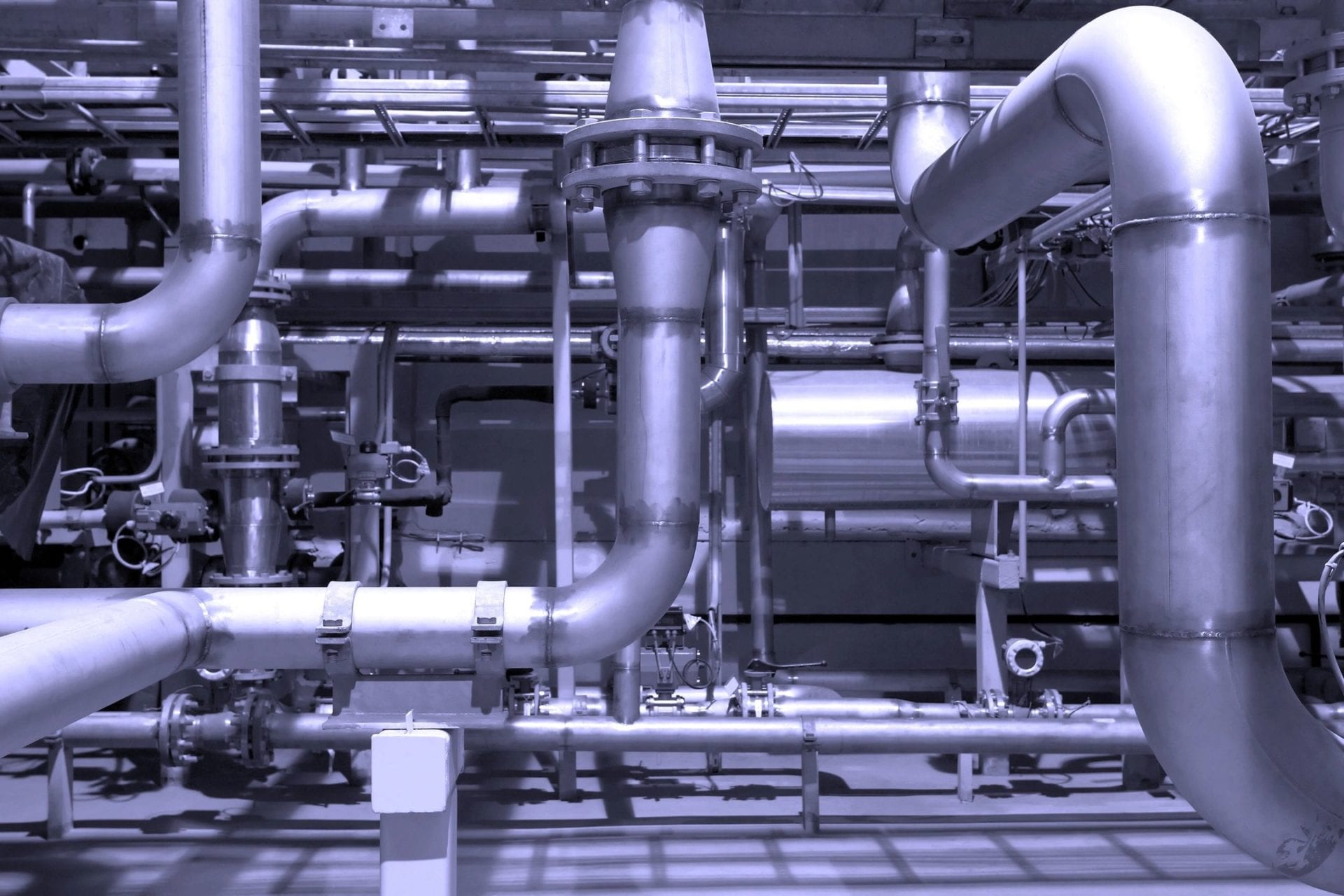A large industrial area with pipes and valves.